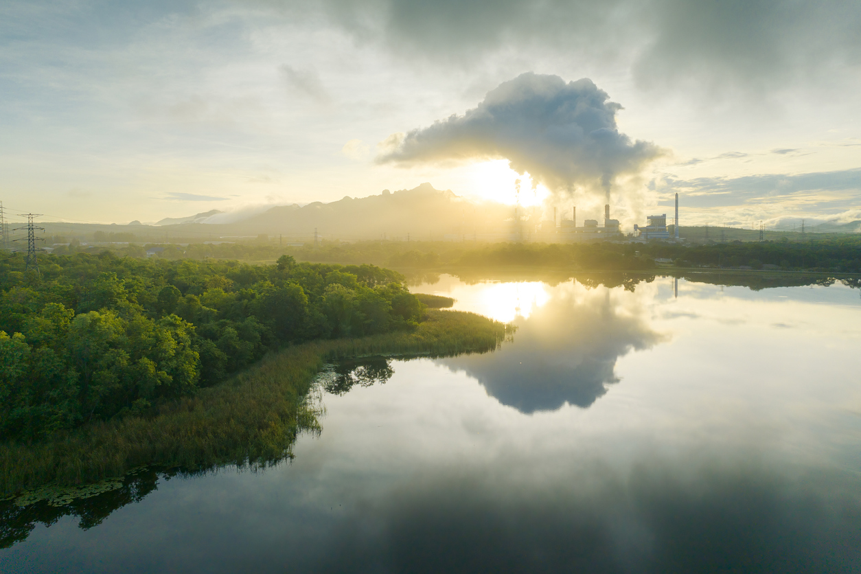 Aerial view coal power plant station in the morning mist. Aerial view coal power plant station in the morning mist, the morning sunrises. coal power plant and environment concept. Coal and steam. Mae Moh, Lampang, Thailand.